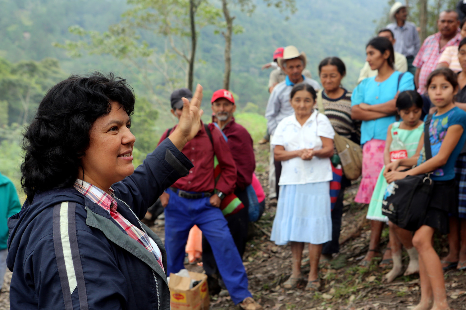 Berta Caceres in the Rio Blanco region of western Honduras where she, COPINH (the Council of Popular and Indigenous Organizations of Honduras) and the people of Rio Blanco have maintained a two year struggle to halt construction on the Agua Zarca Hydroelectric project, that poses grave threats to local environment, river and indigenous Lenca people from the region. She gathered with members of COPINH and Rio Blanco during a meeting remembering community members killed during the two year struggle.